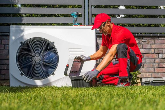 gq0yq technician installs heat pump shutterstock 20231023102913