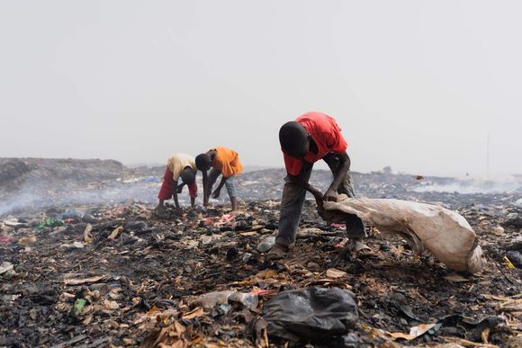 dymww2 three children pick through an african garbage dump searching for recyclable or valuable materials shutterstock 20240127100722