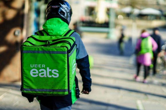 t32yan uber eats guy on foot shutterstock 20240419103242