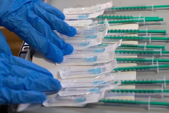 73jv2x syringes filled with the biontech pfizer covid 19 coronavirus vaccine are being prepared in a mobile vaccination center in hemmingen germany on tuesday 20231019093553