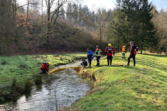 mwated firefighters building dams in the river to stop the oil pollution moving downstream photo cdgis 20240317131012