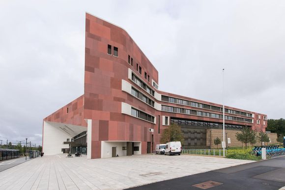 rknbla the red exposed concrete panels were treated with sand blasting water and even acid washing to create the patchwork effect 20240711085910