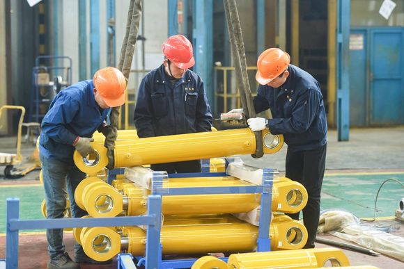 t4oo34 employees work on a cylinder production line at a factory in hangzhou in chinas eastern zhejiang photo afp 20231106135128